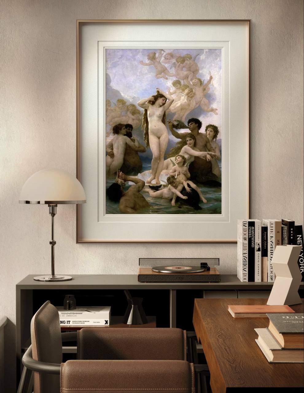The framed "Birth of Venus" painting hangs above a modern console table with books and a record player. The elegant figures and soft colors contrast beautifully with the contemporary decor.