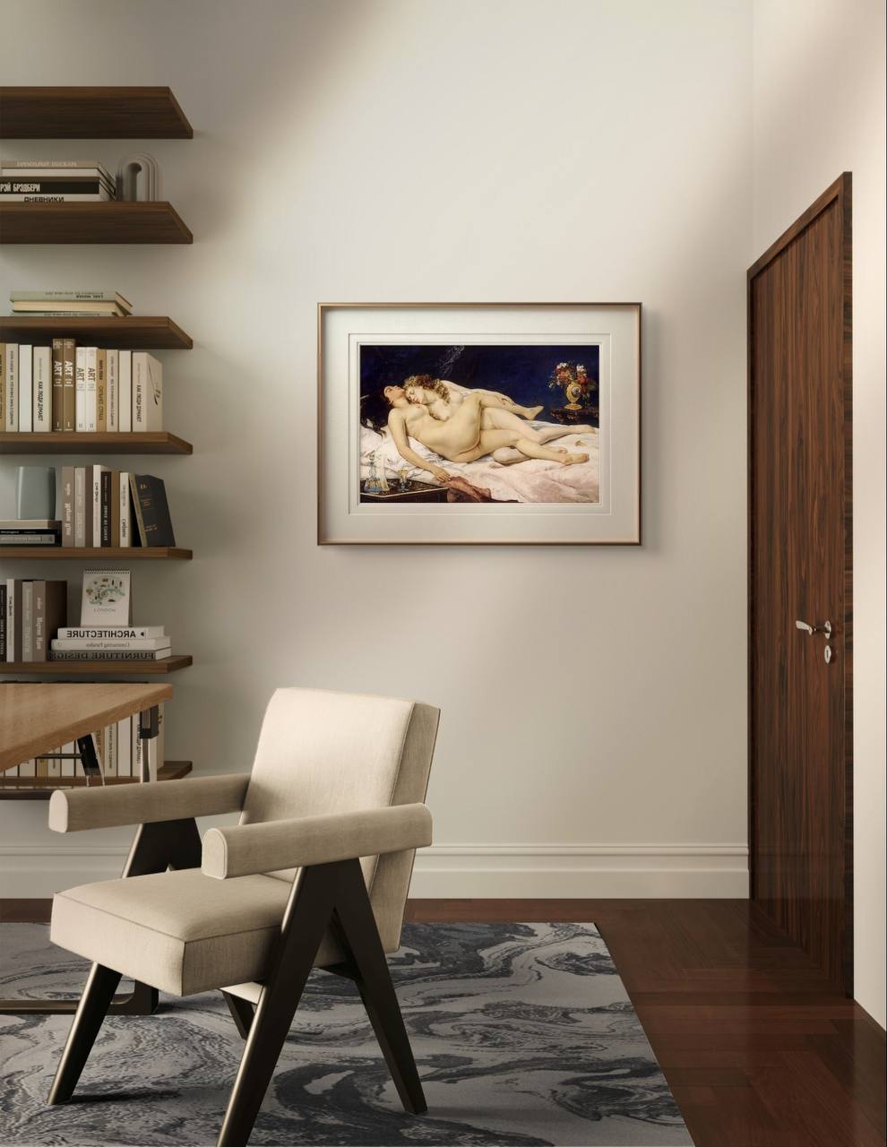 The framed painting of two intertwined women hangs in a minimalist room above a beige chair and desk. The soft tones of the artwork contrast with the clean, modern decor of the space.