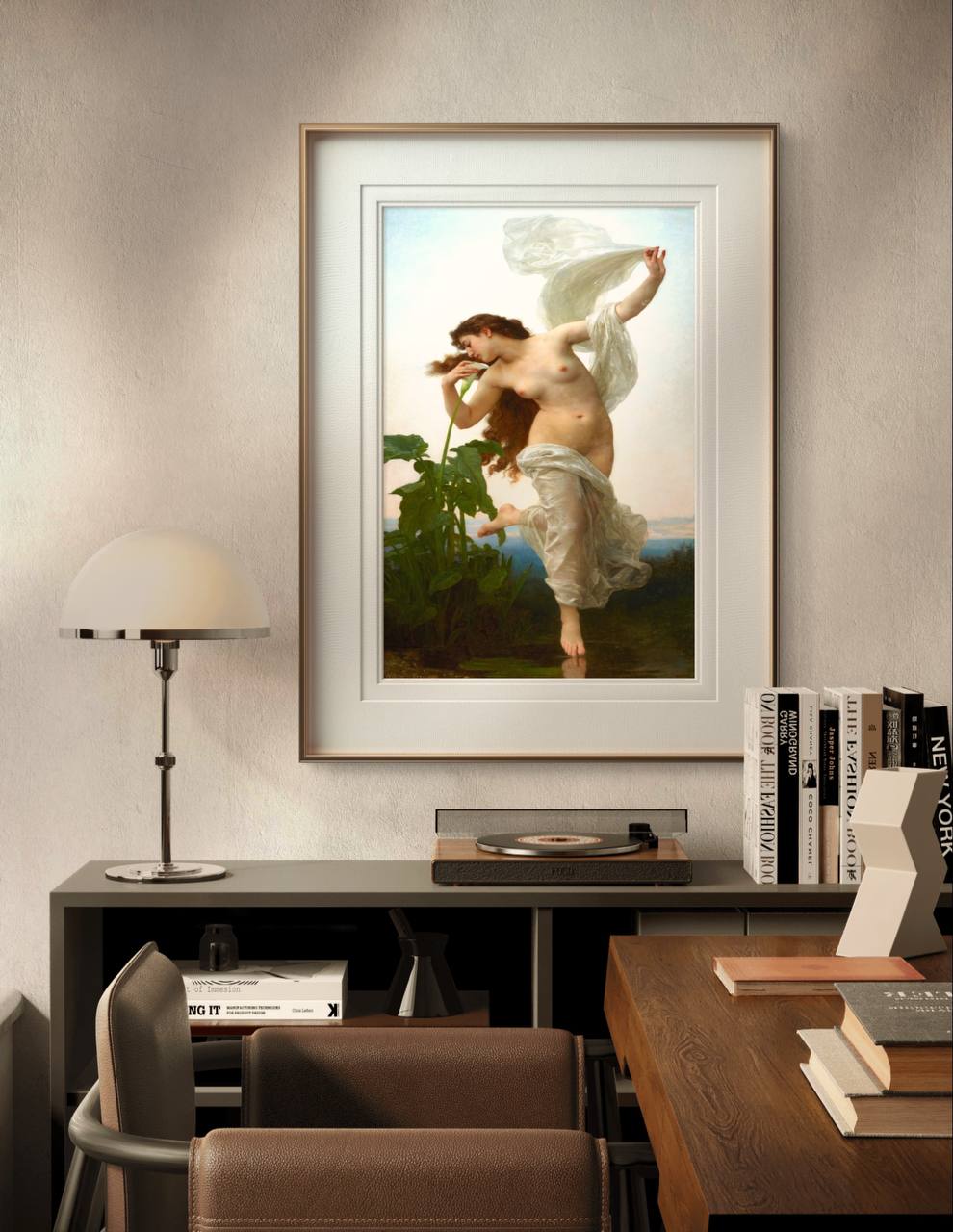 The painting of L'Aurore, framed with white and gold accents, hangs in a cozy home office. The modern decor complements the timeless beauty of the artwork, blending tradition and modernity.