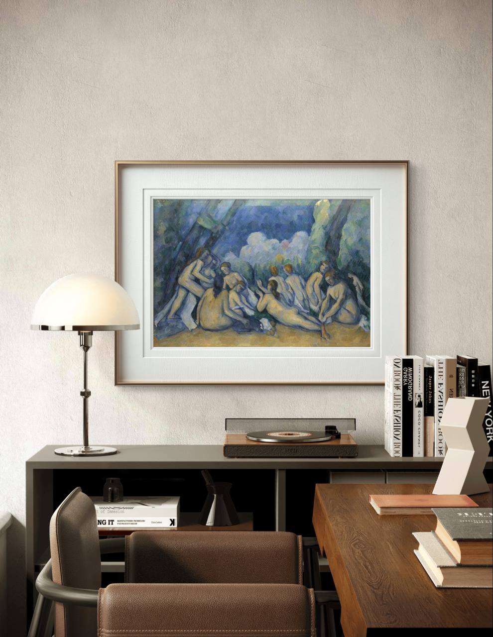 Framed artwork of Cézanne's 'Bathers,' showing a group of nude figures in a serene natural setting. The soft colors and abstract forms add a classic and artistic touch to this modern space