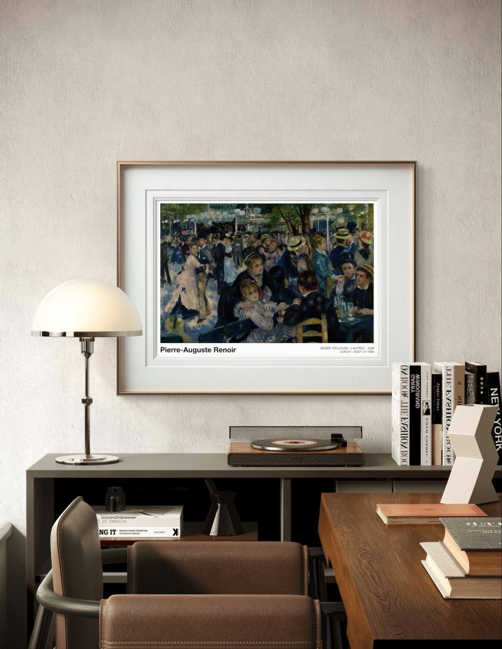 Framed Renoir exhibition poster showing a lively, colorful outdoor gathering. The scene of dancing couples and socializing adds a cheerful and sophisticated ambiance to the study room