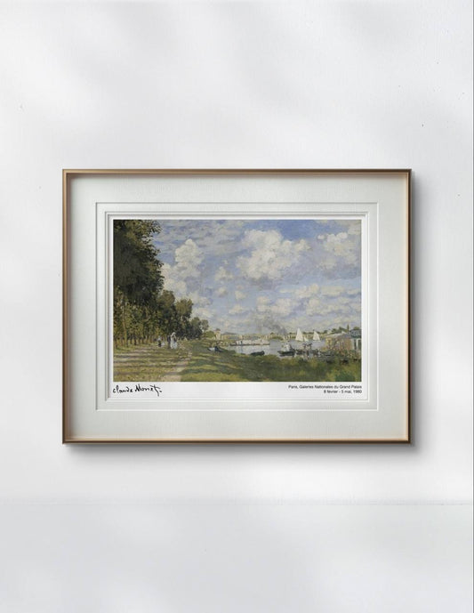 Claude Monet's painting of a peaceful riverside in Argenteuil, France. The scene shows a bright sky with fluffy clouds, trees lining a path, and sailboats gliding on the calm river