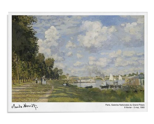 Monet’s riverside painting, featuring sailboats and a tree-lined path, adds a sense of calm and relaxation to this home office. The soft, sunny landscape creates a peaceful environment