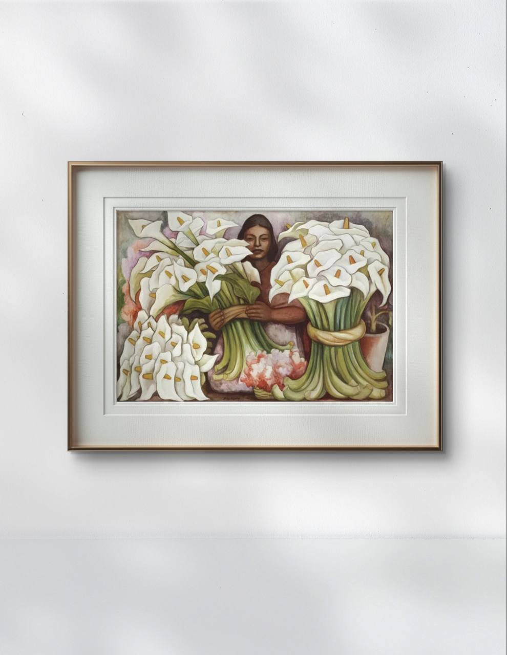 The framed artwork hangs on a simple white wall, creating a striking contrast that draws attention to the vivid details of the painting, with its white lilies and earthy tones.