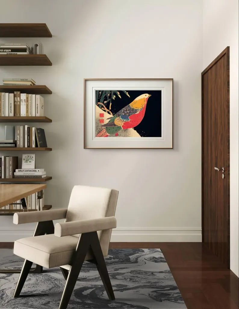 This detailed Japanese print of a golden pheasant is framed above a sleek desk. The vivid bird and soft background blend well with the contemporary room, adding a touch of culture and nature.