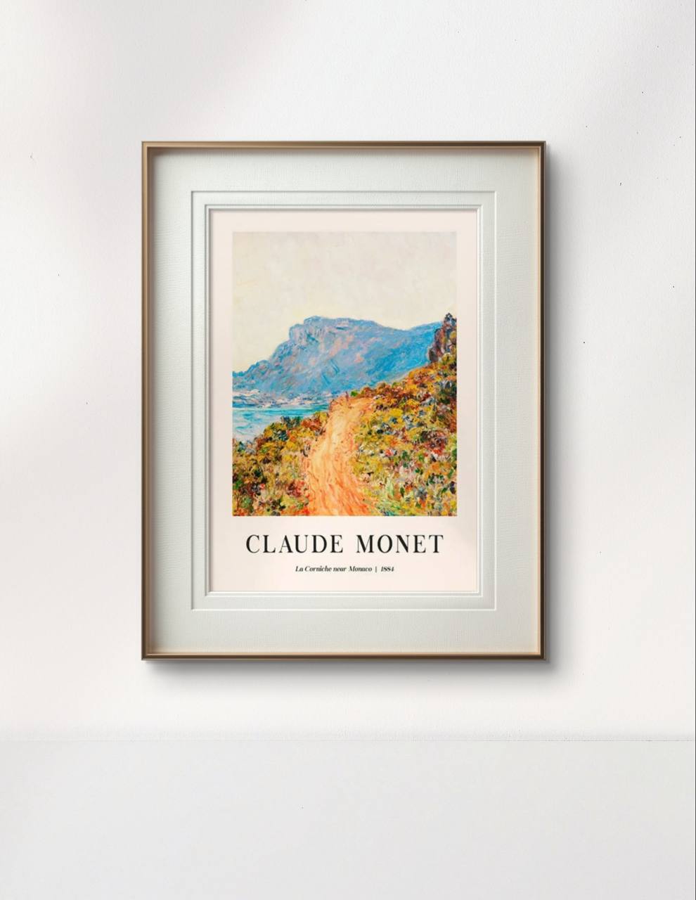 The painting, displayed in a simple, elegant frame, highlights the contrast between the bright orange path and the serene blue mountains in the background. The natural beauty of the scene is emphasized in the minimalist framing.