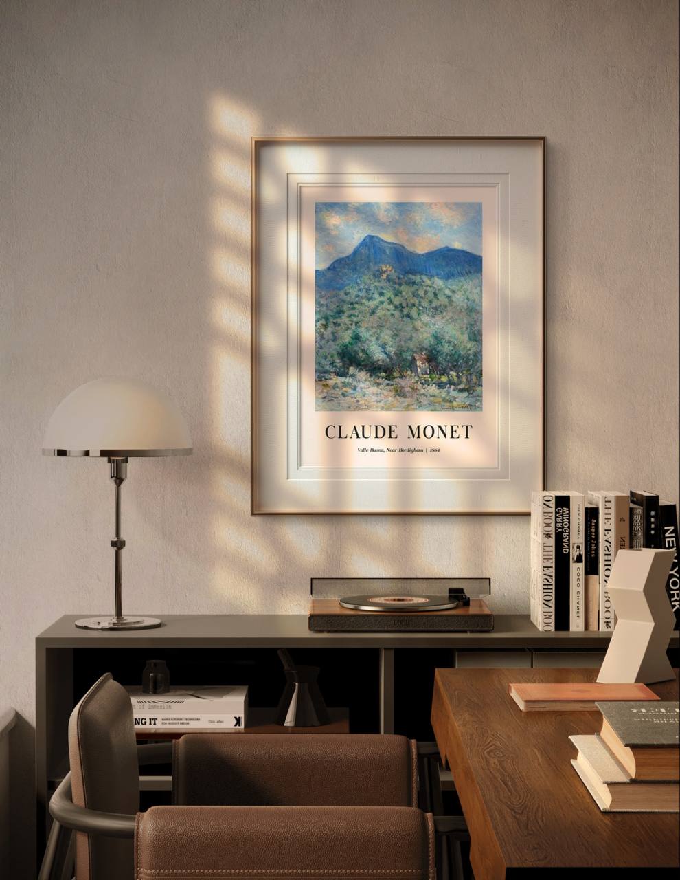 The framed artwork of Valle Buona hangs in a cozy modern room, with soft sunlight casting shadows on the wall. The natural, vibrant scene brings tranquility and elegance to the contemporary decor.