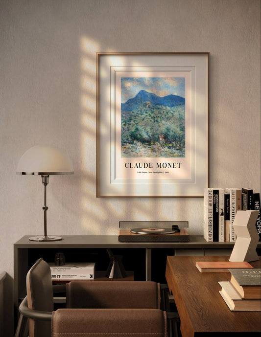 The framed artwork of Valle Buona hangs in a cozy modern room, with soft sunlight casting shadows on the wall. The natural, vibrant scene brings tranquility and elegance to the contemporary decor.