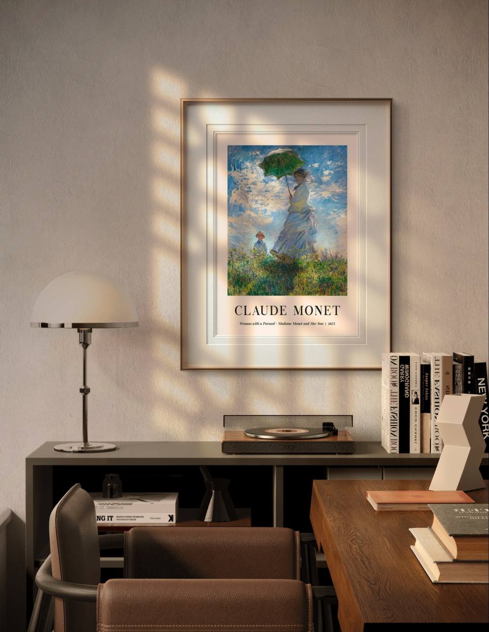 A framed version of the same painting, featuring Madame Monet and her son. The serene colors of the blue sky and the green grass bring a calm, airy atmosphere to the room.