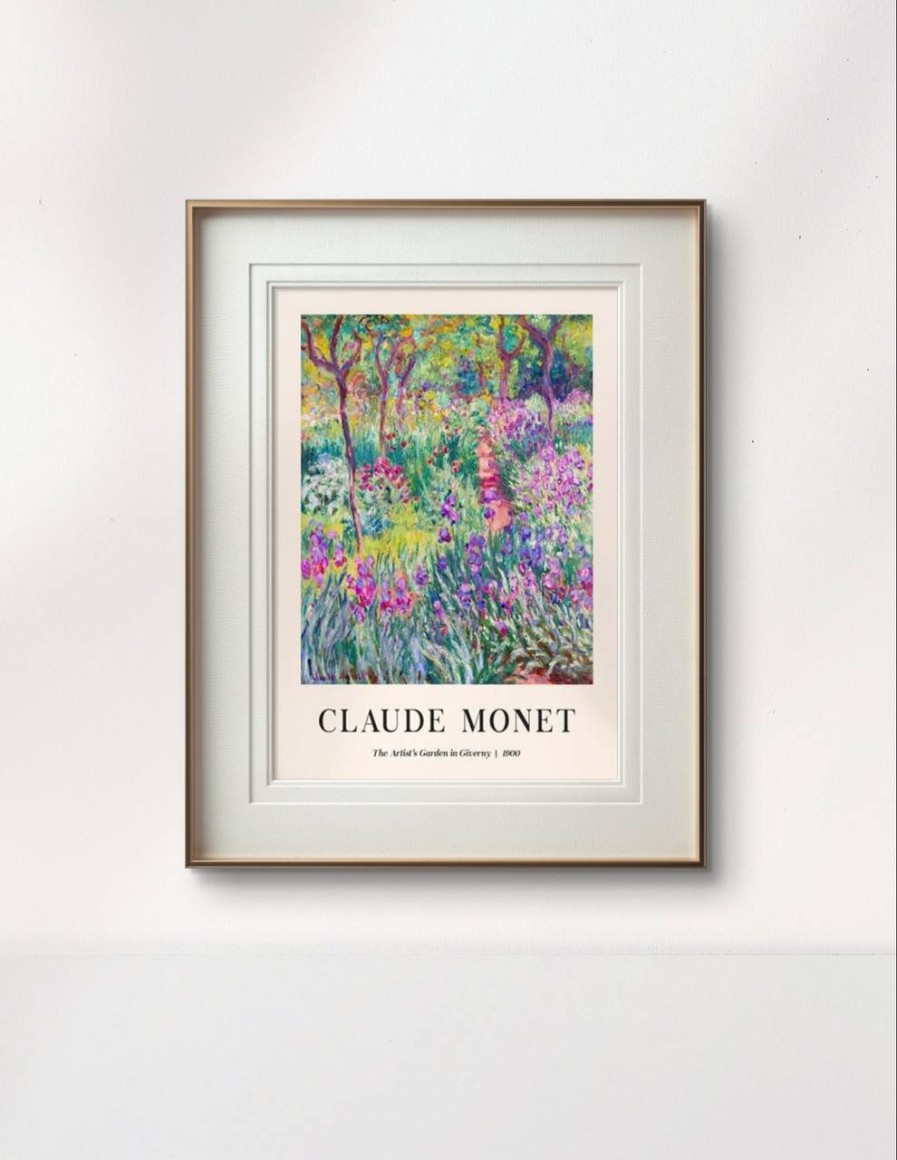 The framed "The Artist's Garden in Giverny" by Monet is hung on a clean white wall. The colorful and lush depiction of the garden brings an air of tranquility and nature into the space.