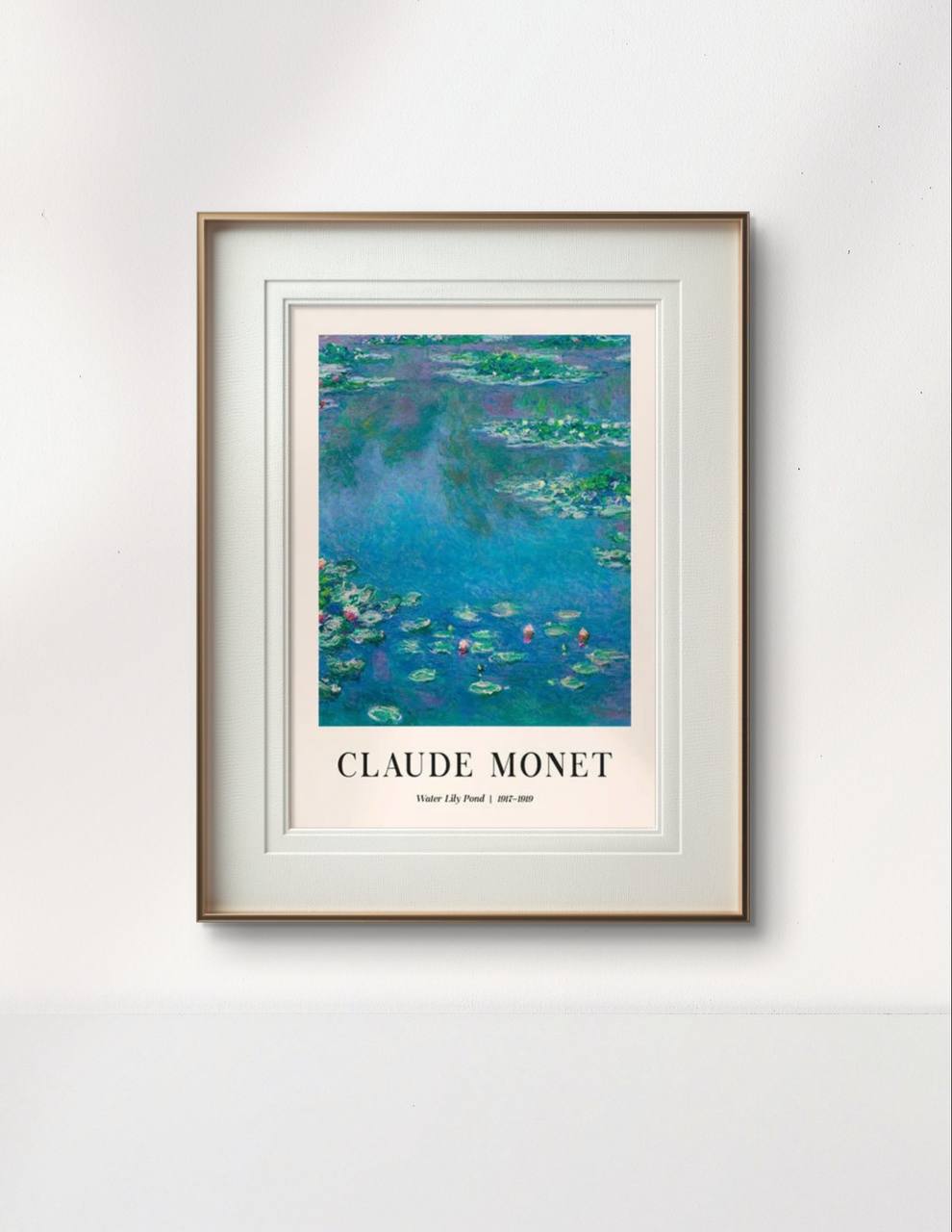 The framed Monet painting, "Water Lily Pond," is displayed on a minimalist white wall, showing tranquil blue water and green lily pads, adding serenity to the space.