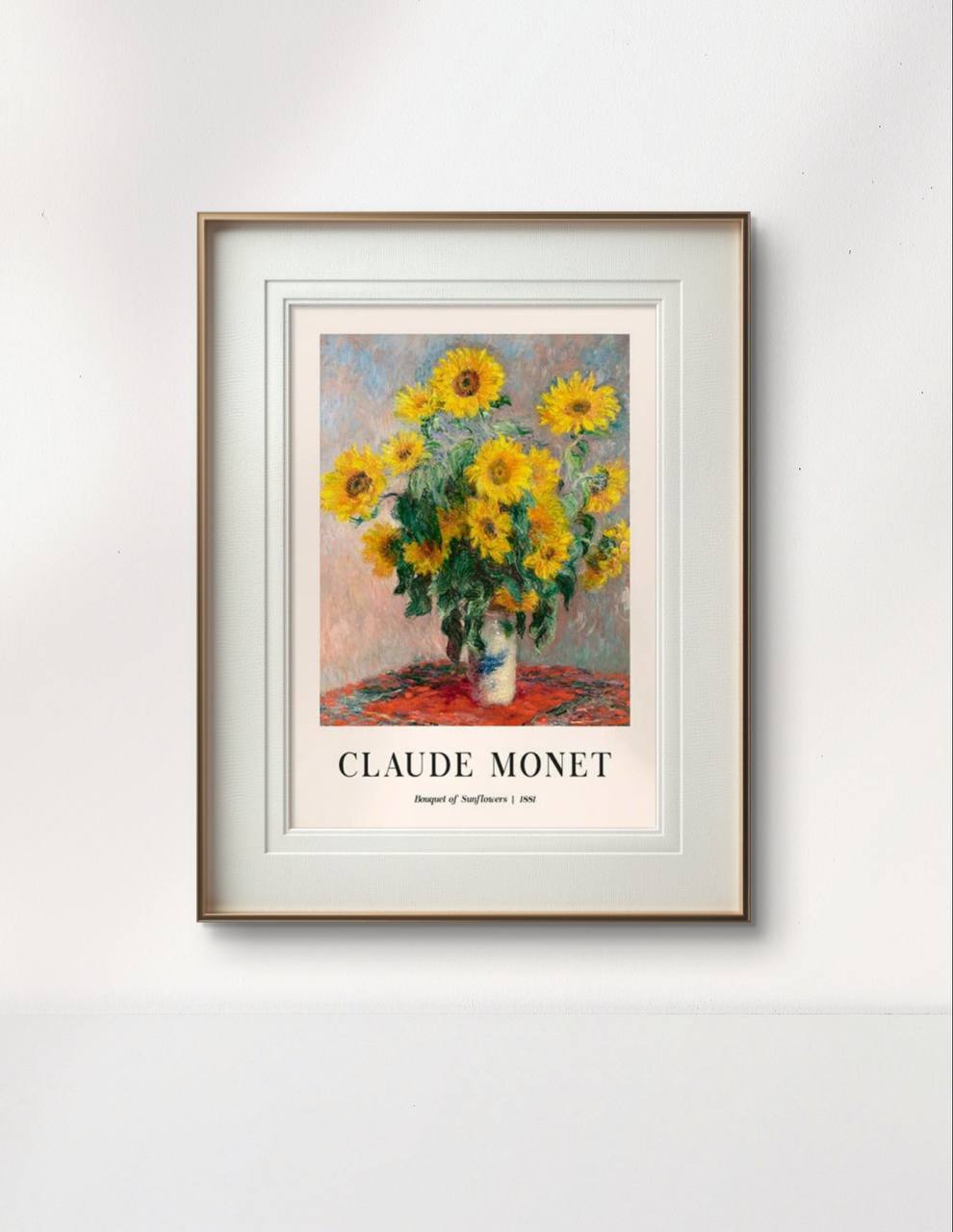 The framed Monet painting, "Bouquet of Sunflowers," is displayed on a minimalist white wall. The bold, cheerful sunflowers add a burst of color and warmth to the room.