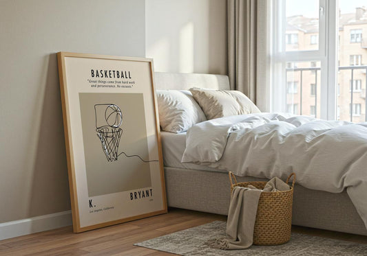 Framed basketball poster on a wall next to a bed in a bedroom