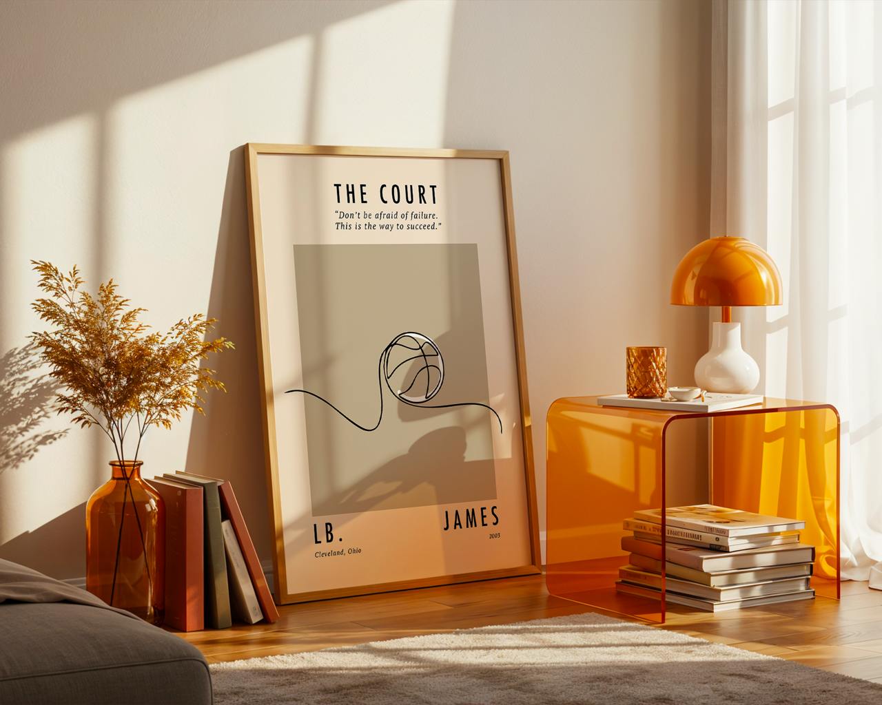 Framed artwork on a wall with a side table and decorative items in a room.