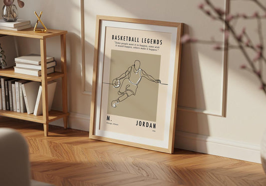 Framed poster of a basketball player on a wall in a room with a bookshelf.