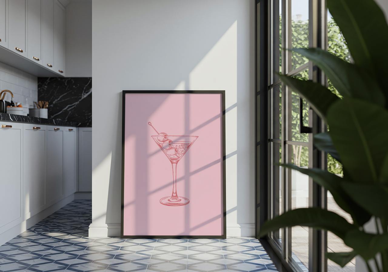 Framed artwork of a cocktail on a pink background in a modern kitchen.