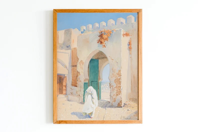 A watercolor painting of a Moroccan doorway with aged, whitewashed walls and a green wooden door. A figure in a white robe walks through the arch, with a clear blue sky overhead. The scene is peaceful and serene, representing Moroccan architecture.