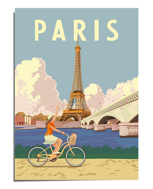 A colorful illustrated poster featuring the Eiffel Tower in the background with a bright blue sky and fluffy clouds. In the foreground, a woman wearing an orange top rides a bicycle along a path, pointing toward the sky. A scenic bridge crosses over a river, adding to the Parisian charm. The word "PARIS" is displayed in bold letters at the top.