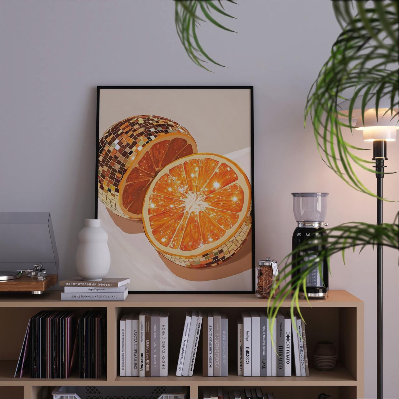 Framed artwork of oranges on a bookshelf with decorative items