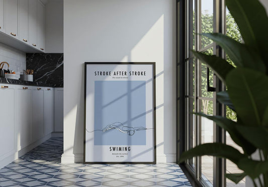 Framed poster titled 'Stroke After Stroke' in a modern kitchen setting