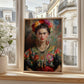 This striking image features a beautifully framed portrait of a woman, reminiscent of the iconic artist Frida Kahlo, known for her powerful self-portraits and vibrant representation of Mexican culture.he artwork is positioned on a sunlit windowsill, where natural light enhances its rich colors and intricate details, creating an inviting atmosphere.