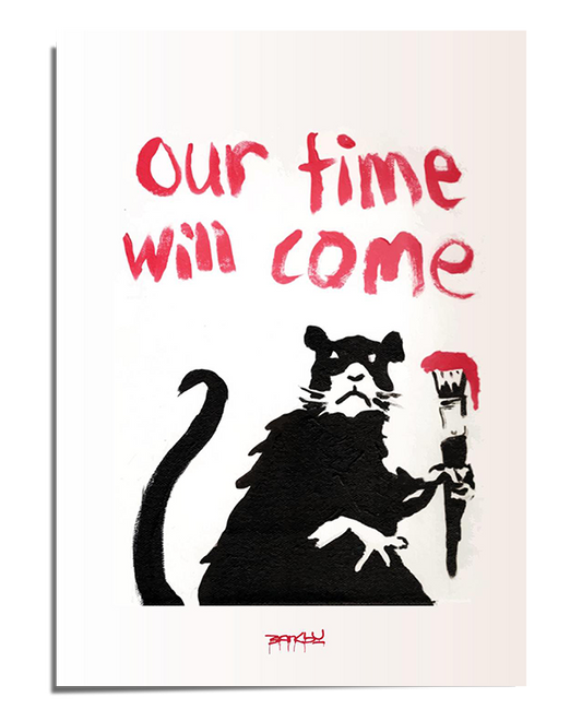 A black-and-white stencil-style artwork of a rat wearing a tattered robe, holding a paintbrush dripping in red. Above the rat, the phrase "Our Time Will Come" is written in bold red graffiti-style text. The minimalistic background highlights the striking contrast of the stencil and lettering
