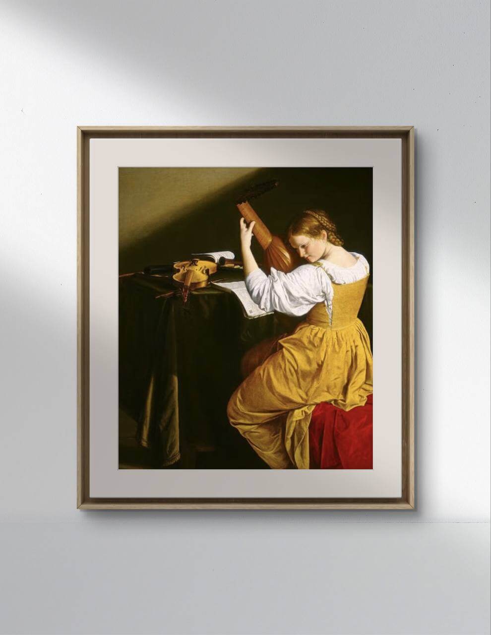 A framed poster of "The Lute Player" by Orazio Gentileschi, showcasing a young woman in a yellow dress playing a lute, with dramatic lighting. The wall art captures the essence of classical painting, perfect for home decor and enriching any home gallery wall with historical artwork.