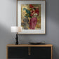 A modern interior setting with a wooden console table, a black table lamp, and a framed poster of "A Windy Day" by Gaetano Bellei hanging above. The wall art adds a dynamic and colorful touch to the room, ideal for home decor and enhancing any living space with classical art that celebrates movement and joy.