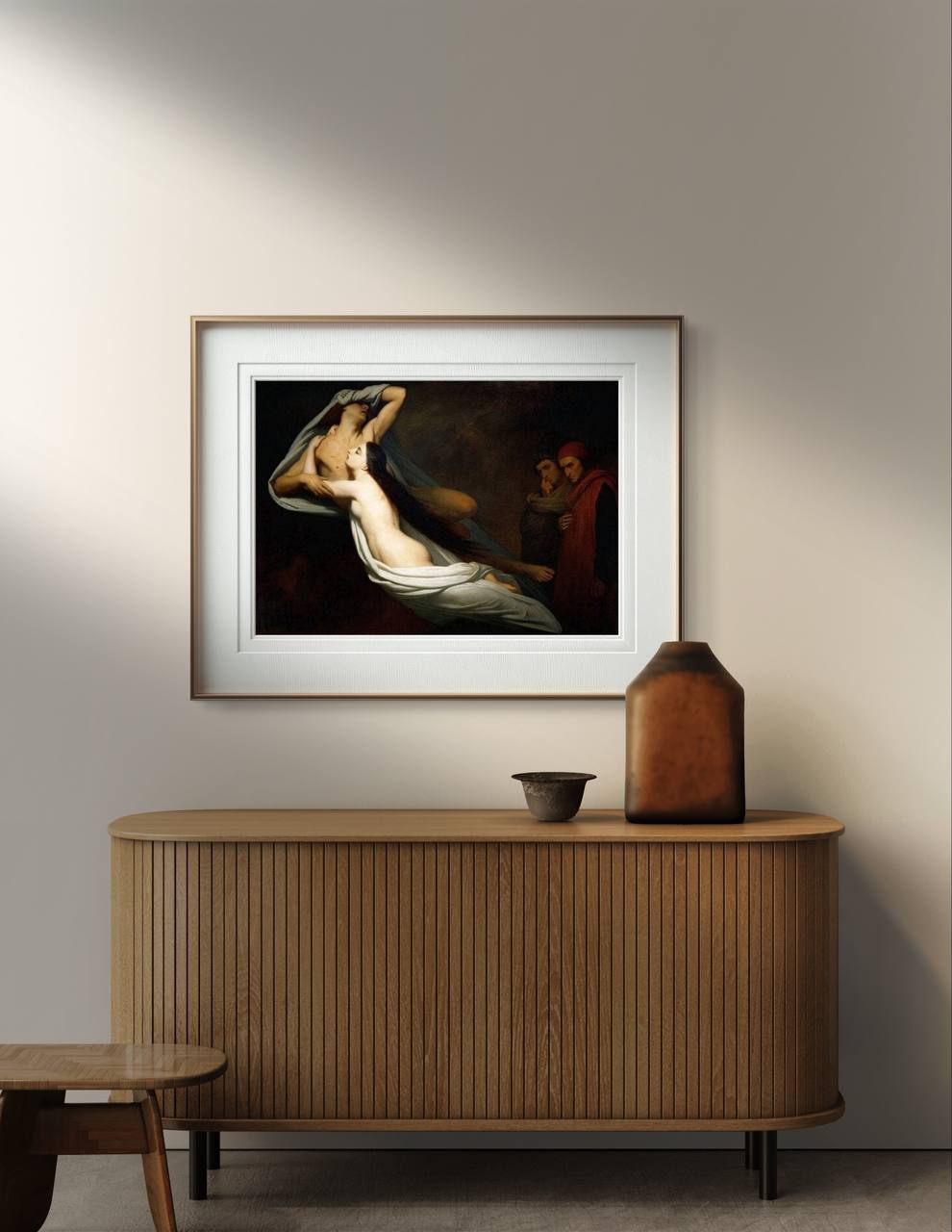 A modern interior space with a wooden console table and a framed poster of "The Ghosts of Paolo and Francesca" by Ary Scheffer. The painting's dark tones and ethereal depiction of the lovers are beautifully displayed, making it a perfect addition to your home gallery wall or living space. This Romantic artwork brings a touch of classical art and emotional depth to your decor.