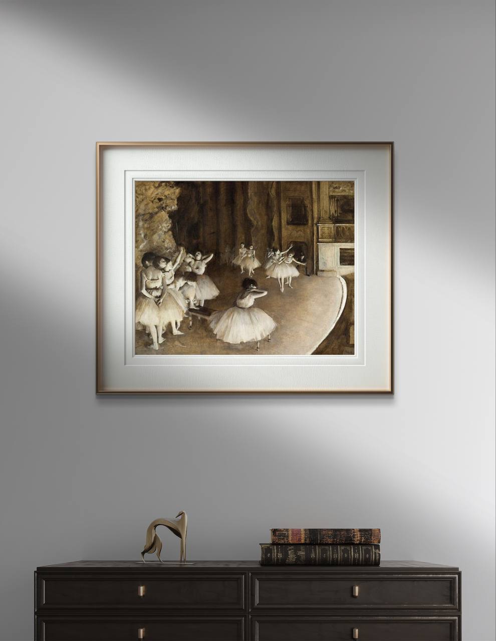A stylishly Art reproduction. Degas print of "The Ballet Rehearsal on Stage" by Edgar Degas, elegantly showcased in a contemporary room. The artwork features ballerinas during a rehearsal, depicted with intricate detail and a soft, muted color scheme. This reproduction adds a touch of sophistication and cultural depth to any interior decor. 