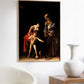 Caravaggio poster displayed on a modern white wall, framed in a simple, elegant frame. The clean, minimalist setting highlights the dramatic contrast and emotional intensity of the artwork. The powerful use of light and shadow in the painting is accentuated, making the classical scene stand out in a contemporary home decor setting.