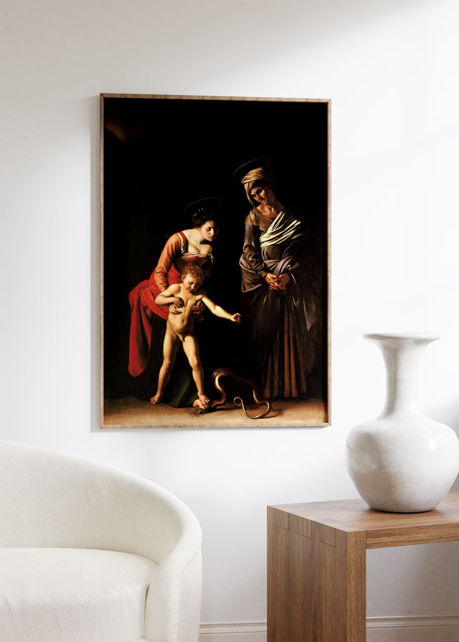 Caravaggio poster displayed on a modern white wall, framed in a simple, elegant frame. The clean, minimalist setting highlights the dramatic contrast and emotional intensity of the artwork. The powerful use of light and shadow in the painting is accentuated, making the classical scene stand out in a contemporary home decor setting.