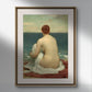 The second image shows the same poster of "Psamathe" by Frederick Leighton in a minimalist frame with a golden edge, hung on a gray wall above a dark wooden cabinet. The cabinet holds antique books and a modern sculpture, blending classic and contemporary elements. The painting's serene beach scene adds a calming atmosphere to the room.