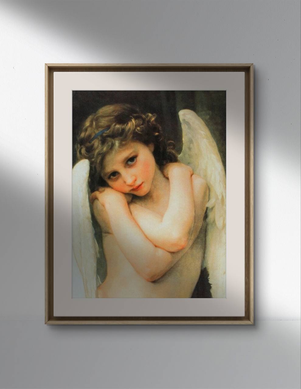 The first image shows a framed poster of William Bouguereau's painting "Wet Cupid." The artwork features a young cherubic angel with curly hair, gazing tenderly at the viewer with folded arms. The angel's wings and delicate features are beautifully highlighted, creating a serene and captivating image. The poster is presented in a simple frame that enhances the classic feel of the artwork.