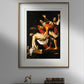 The first image shows a framed poster of Caravaggio's "The Deposition of Christ" on a gray wall. The framed poster features a simple golden border, enhancing the dramatic depiction of Christ being lowered from the cross. Below this classical art reproduction, there's a dark wooden table with antique books and a modern decorative sculpture, adding a touch of elegance to the wall decor.