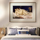 The painting of two reclining women is displayed above a bed with blue-patterned pillows. The soft lighting and elegant arrangement create a peaceful, intimate atmosphere in the bedroom