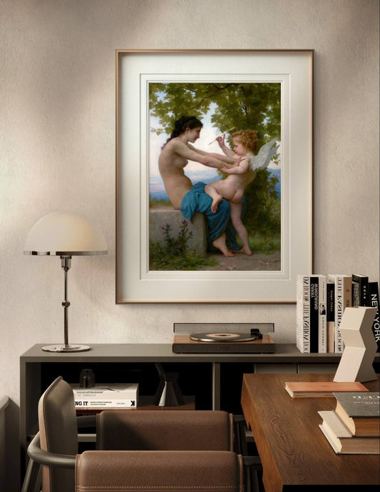 The framed painting of the woman and Eros is displayed in a warm home office. The decor includes a wooden desk, a modern lamp, and bookshelves, blending classic art with a modern interior design.