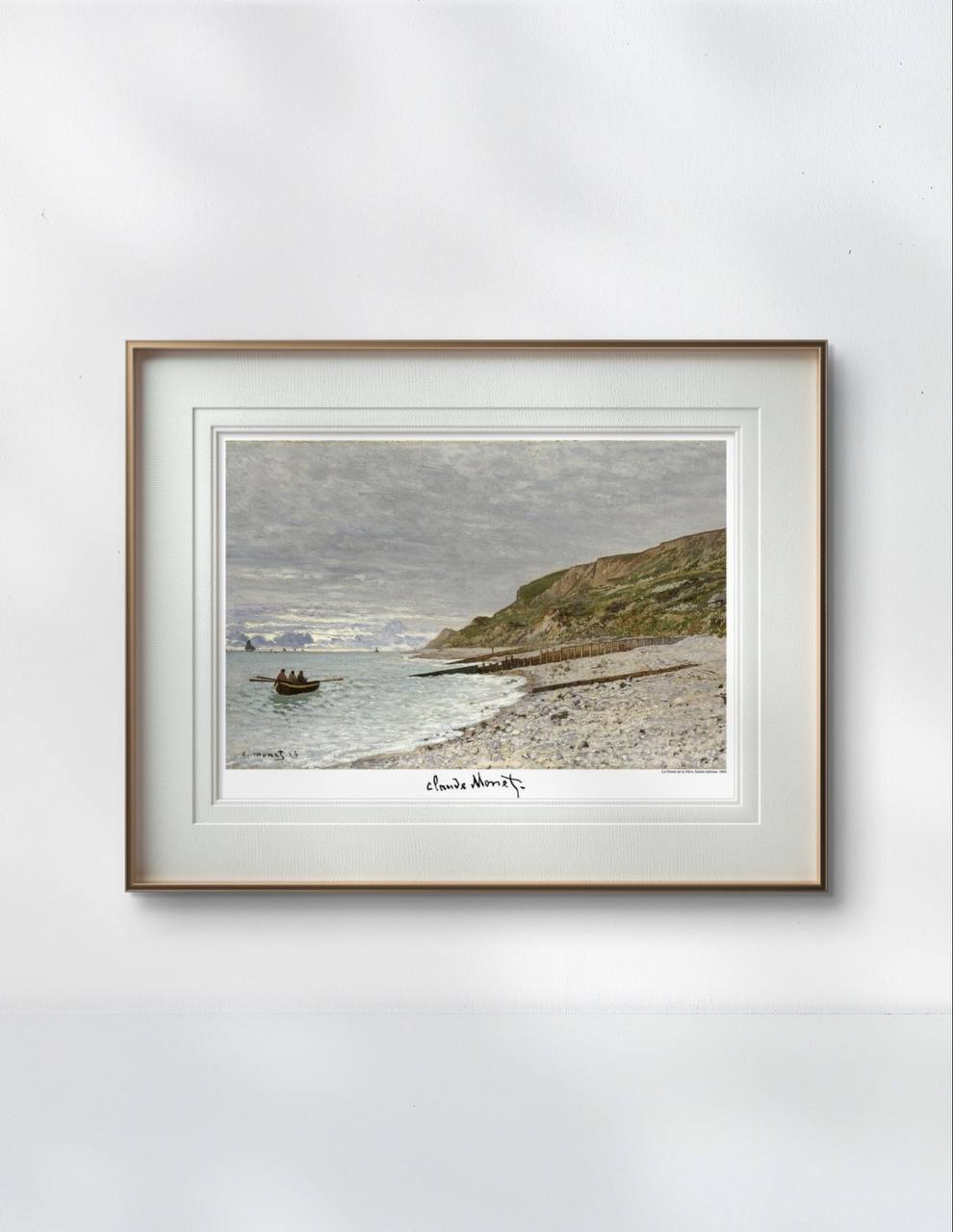 Framed Monet print depicting a tranquil shoreline with a boat on calm waters. The soft, muted tones and expansive coastal landscape create a serene focal point for this elegantly decorated dining room.