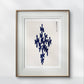 Framed abstract artwork with a central navy blue shape on a light background, adding a modern and calming aesthetic to the room. The subtle Japanese influence enhances its artistic appeal.