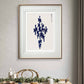 Minimalist abstract painting with a dark blue, fluid shape set against a light backdrop. The framed artwork brings a touch of contemporary design to the dining room, creating a serene atmosphere