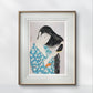 Framed print of a Japanese woman in a blue kimono combing her hair. The serene and graceful illustration brings a calming and artistic presence to the room's decor.