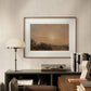 A framed John Constable landscape painting is displayed above a modern desk. The earthy tones of the painting, coupled with the minimalist decor, create a peaceful, elegant space