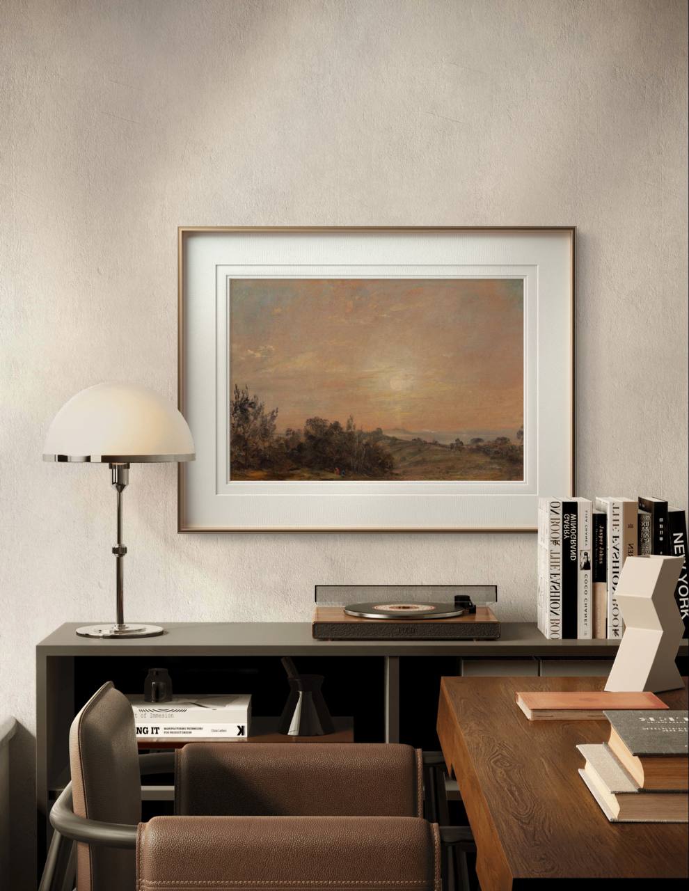 A framed John Constable landscape painting is displayed above a modern desk. The earthy tones of the painting, coupled with the minimalist decor, create a peaceful, elegant space