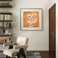 A framed abstract print of Paul Klee's 'Senecio,' featuring a geometric face in warm, earthy tones. The vibrant colors add a lively yet harmonious touch to the modern room decor