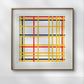 A framed Mondrian-style abstract artwork hangs in a contemporary office space. The vibrant grid of colorful lines brings a sense of structure and order to the room.