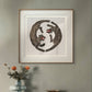 A framed illustration of two black-striped tigers, positioned in a circular pattern with red mouths open. The minimalist, elegant design is framed in gold and white, hanging above a wooden cabinet with a glass vase and orange flowers.