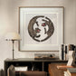  The same framed illustration of two tigers is shown in a modern workspace. It hangs above a desk with books and a record player, blending vintage Japanese art with a sleek, contemporary interior design.