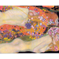 A dreamy, colorful painting by Gustav Klimt, depicting intertwined figures adorned with flowers and flowing lines. The vibrant reds, yellows, and purples create a surreal, flowing composition, evoking beauty, serenity, and sensuality.
