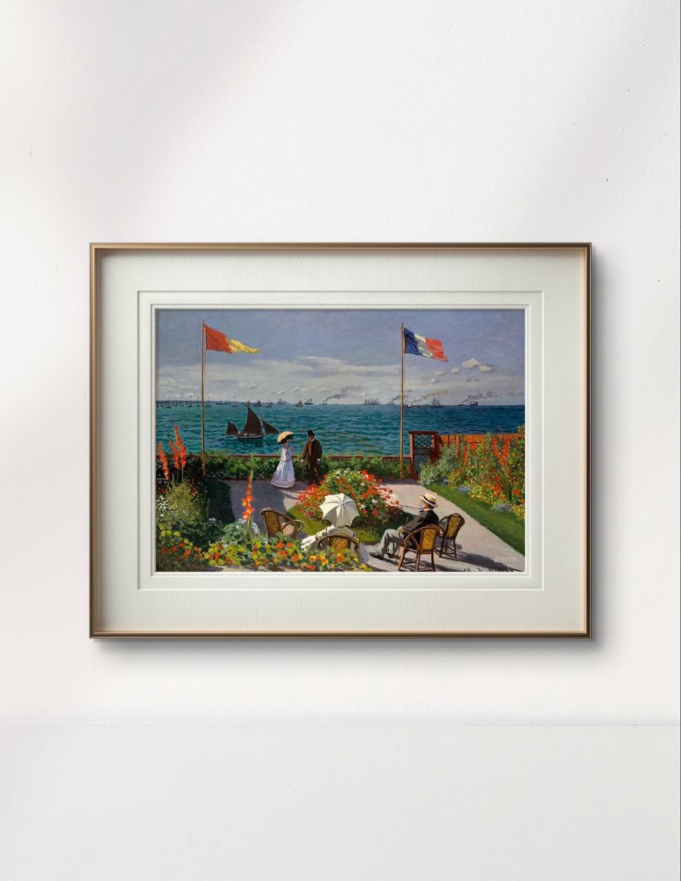 he same painting, framed with a white mat and wooden border, captures a lively scene of people enjoying a garden by the sea. Vibrant flowers and flags contrast with the blue ocean in the background.