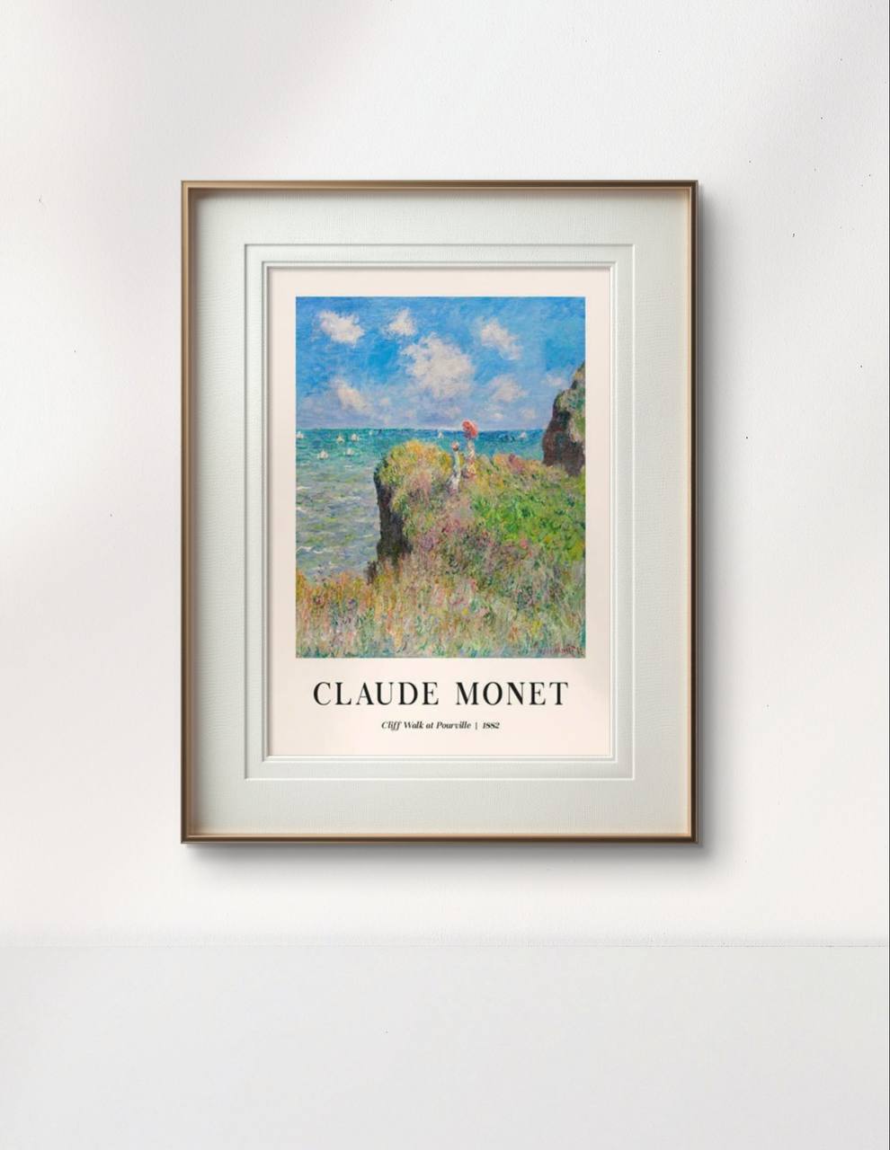 The same cliffside scene is framed with white matting and wooden borders, showcasing the serene coastal view. The painting’s bright colors and calm atmosphere are enhanced by the simplicity of the frame.